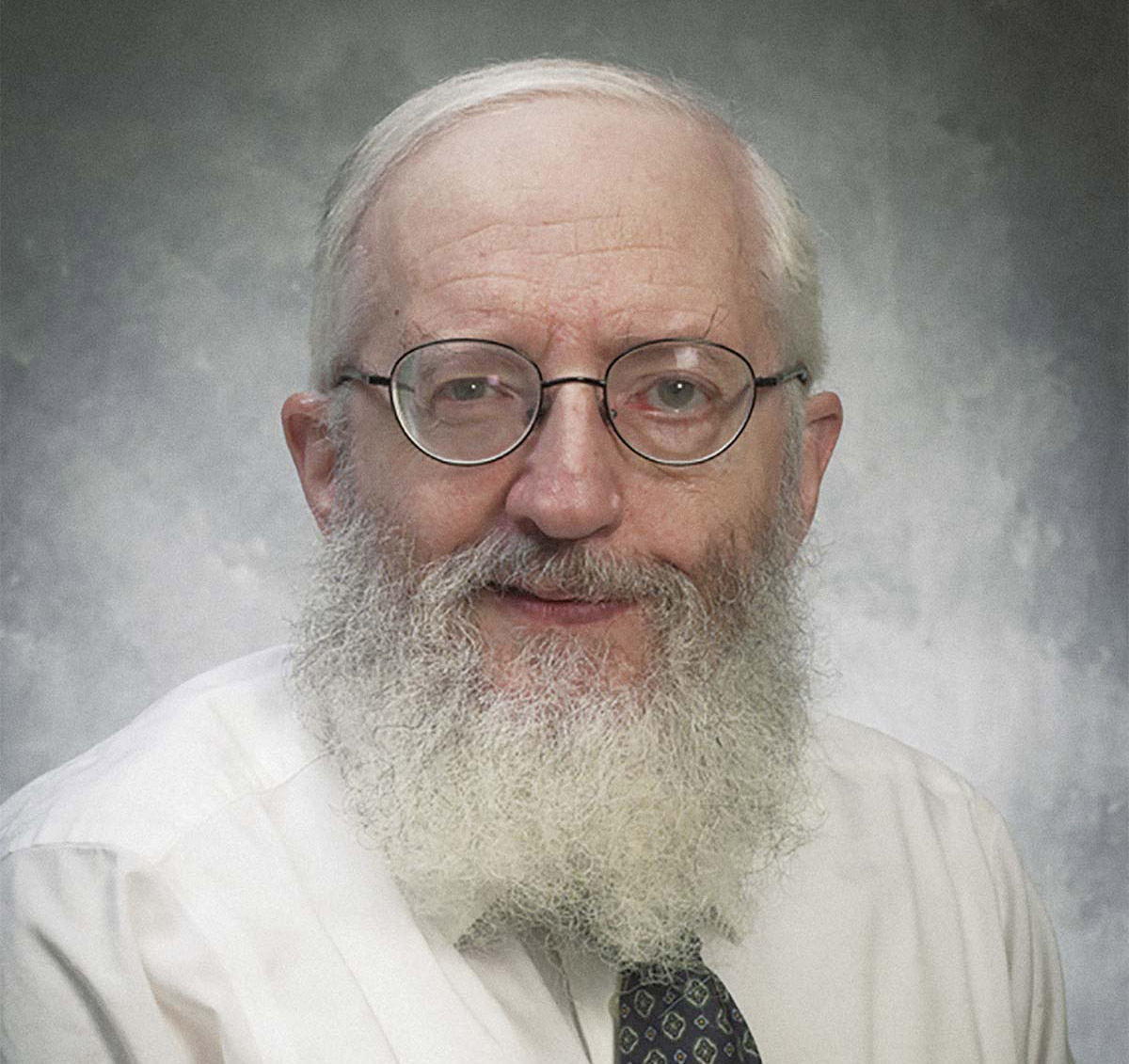Professor Shakow in a white shirt and tie