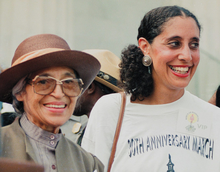 Rosa Parks and Lani Guinier greet the crowd from the podium at the 1993 March on Washington.