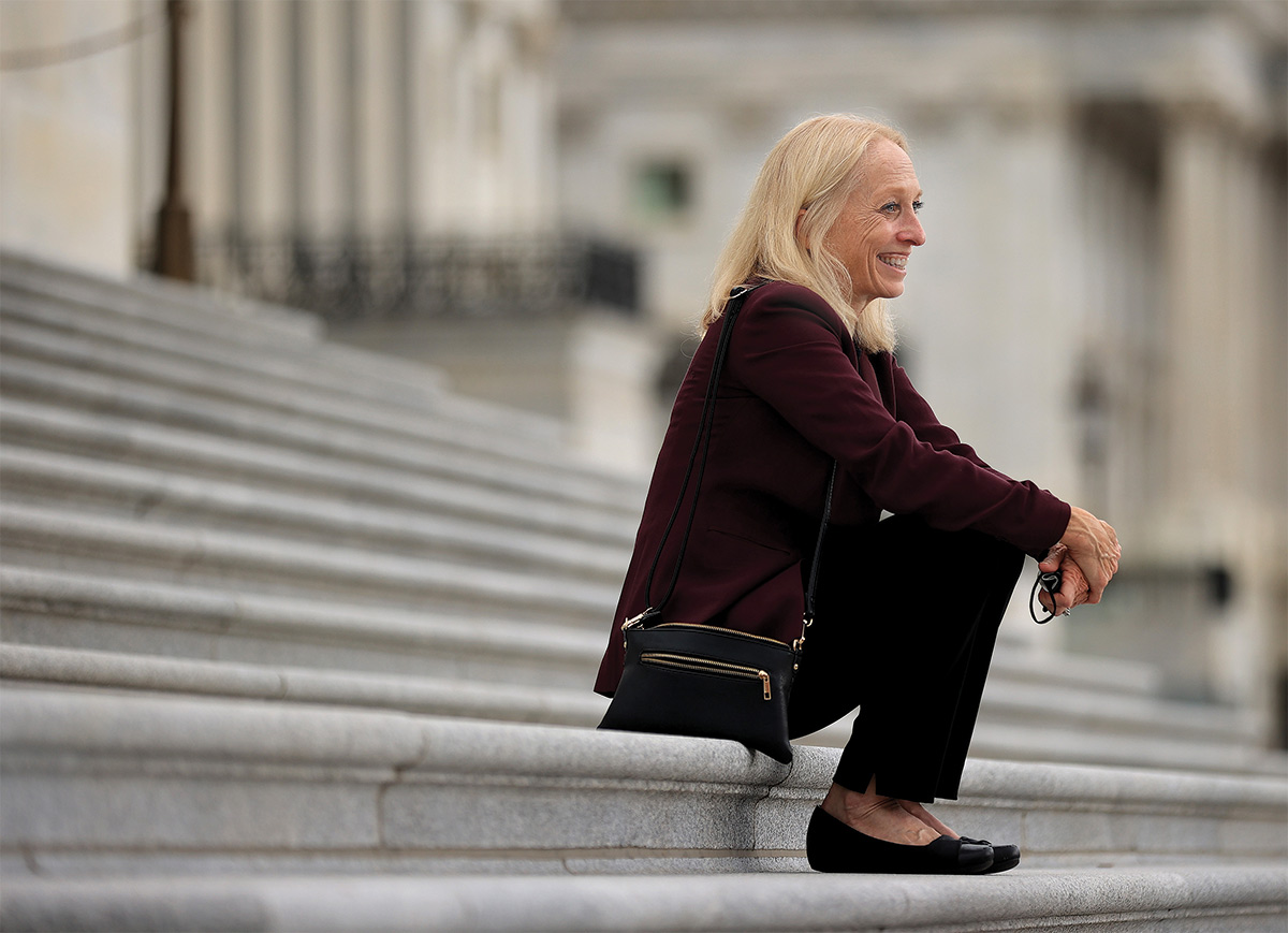 Mary Gay Scanlon sitting on Capitol steps