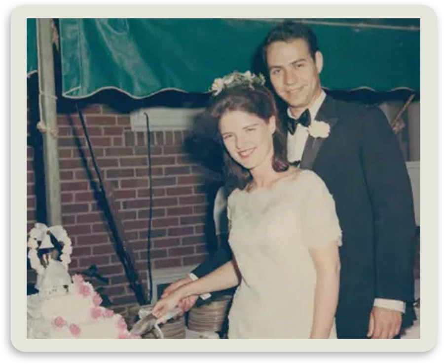 old photo of Wachter and his wife Susan cutting wedding cake