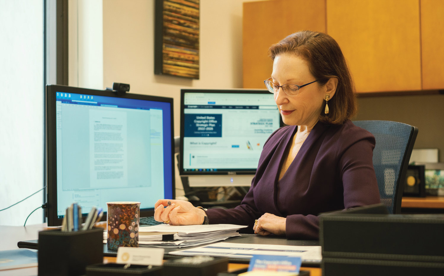 Shira Perlmutter working at her office desk